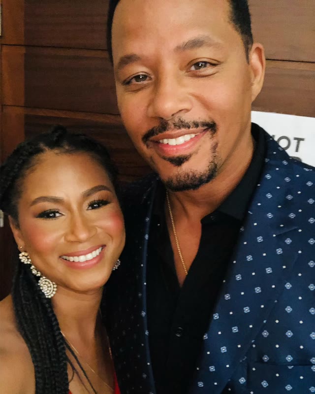 Rayma and Terrence Howard, side by side, smiling at the camera at an event.
