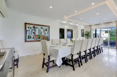 A formal dining room seating sixteen