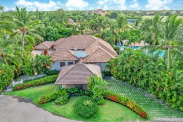 The tile-roofed villa seen from the air