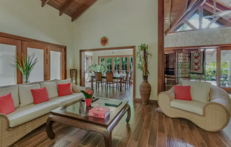 A living room under a pitched wooden ceiling